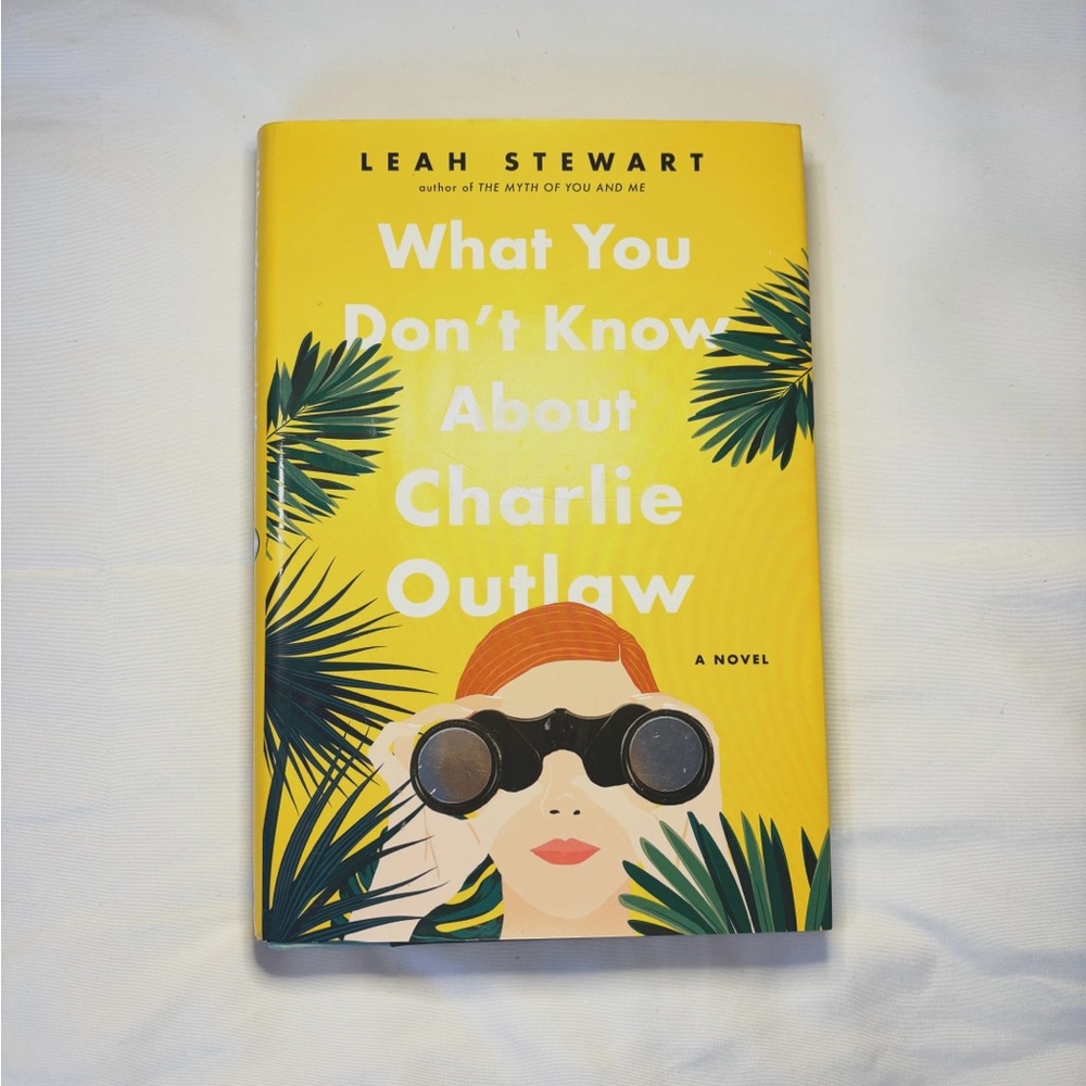 Yellow Book Cover with Tropical Palm Fronds and Sunglasses Illustration